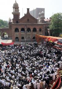 Pakistani lawyers and their supporters gather in Lahore to greet Chief Justice Iftikhar Chaudhry in May 2007
