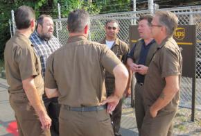 Tim Sylvester (left, facing camera), the newly elected president of Teamsters Local 804, with a group of UPS drivers
